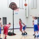Portable basketball hoop stand with adjustable height, shatterproof backboard, and wheels for easy transport and.