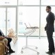 Height adjustable mobile standing desk with detachable holder, featuring a robust aluminum frame and flexible wheels.