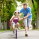 16-inch kids bike with doll seat and removable training wheels, featuring adjustable seat and hand brake for safety.