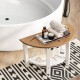 Semicircular waterproof HDPE shower bench with storage shelf, featuring towels and toiletries, ideal for bathroom use.