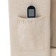 Close-up of the elastic pocket on the upholstered bed frame, perfect for storing remotes and smartphones.