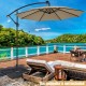 Cantilever offset patio umbrella base with easy-fill spouts, made of durable HDPE, ideal for stability and transport.