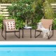Patio conversation set featuring two chairs with breathable fabric and a glass-top table, perfect for poolside.