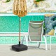 Fillable black patio umbrella base with handle, designed for 1.5-inch poles, placed by a poolside lounge chair.