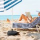 Fillable black patio umbrella base with handle, designed for 1.5-inch poles, providing stability for beach or patio use.