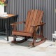 Outdoor wooden kid Adirondack rocking chair in coffee color with slatted seat, perfect for relaxing in outdoor spaces.