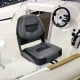 Folding low back fishing boat seat in black with ergonomic backrest, designed for comfort and durability in marine.