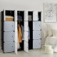 16-cube storage organizer in black with open doors, ideal for clothes and accessories in bedroom or living room.