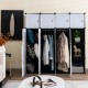 16-cube storage organizer in black with hanging rods, ideal for clothes and accessories in any room.