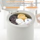 Towel warmer bucket with rolled towels inside, featuring one-button control and 60-minute auto shut-off for safety.