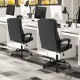 High back ergonomic executive chair in black with thick headrest cushion and adjustable height for office use.