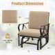 Patio glider rocking chair with tan thick cushion, curved armrests, and dimensions for outdoor relaxation.