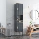 Narrow gray free-standing bathroom cabinet with doors and drawer, featuring adjustable shelves and solid metal legs.