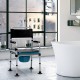 4-in-1 folding bedside commode chair with detachable bucket, adjustable height, and ergonomic armrests for comfort.