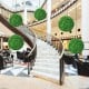 Two 19.5-inch faux boxwood topiary balls made of UV-proof PE material, enhancing indoor and outdoor spaces.