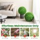 Two 19.5-inch faux boxwood topiary balls in a living room, perfect for effortless indoor decoration without maintenance.