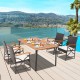 Outdoor dining set featuring an acacia wood table and hand-woven PE rattan chairs, perfect for patio gatherings.