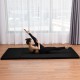 Folding black gymnastics mat for exercise, yoga, and dance, featuring four panels and a hand carry belt for portability.