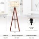 Tripod floor lamp with brown rubber wood base and flaxen lampshade, featuring E26 socket and round shelf for storage.