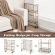2-tier mobile serving cart with tempered glass shelves, golden metal frame, and folding design for easy storage and.