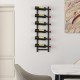 Wall-mounted wine rack holding six bottles, featuring a sleek design for space-saving home decoration.