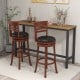Set of 2 brown bar stools with PU upholstered seats, featuring a 360° swivel design, ideal for kitchen or pub use.