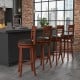 Set of 2 brown bar stools with PU upholstered seats, 360° swivel design, perfect for kitchen or cafe use.