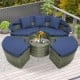 Round outdoor daybed with navy cushions and retractable canopy, made of gray PE wicker, ideal for patio relaxation.