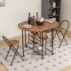 Folding dining table and chair set in rustic brown with storage shelves, perfect for small spaces and easy movement.
