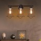 3-light vanity lamp with metal wire cage in oil rubbed bronze finish, perfect for vintage-style bathroom or living room.