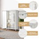 Rolling storage armoire closet in white with adjustable shelf, hanging rod, and magnetic catch for children's clothes.