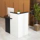 L-shaped black and white reception desk with adjustable shelf and lockable drawer, ideal for office or retail use.