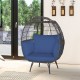 Oversized patio rattan egg lounge chair with navy cushions, featuring a cozy design and sturdy metal frame for outdoor.