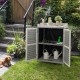 Garden potting bench table in gray with open doors, showcasing 2 storage shelves and a metal tabletop for versatile use.