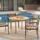 Round outdoor dining table made of acacia wood, seating four, ideal for poolside gatherings and easy to clean.