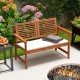 Solid wood patio bench for 2 with backrest and cushion, perfect for backyard relaxation and outdoor gatherings.