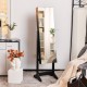 Freestanding jewelry cabinet in black with full-length mirror, ample storage, and auto on LED lights for convenience.
