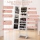 Freestanding jewelry cabinet in white with full-length mirror, LED lights, and ample storage for jewelry and.
