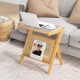 Boho end table with natural bamboo frame, tempered glass top, and magazine rack, perfect for living room use.