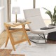 Boho end table with rattan decoration and tempered glass top, featuring a magazine rack for stylish organization.