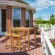 Rectangular acacia wood bar height table on a patio, ideal for dining and drinks in outdoor spaces.