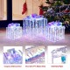 Iridescent Christmas gift box with a decorative bow, featuring sturdy metal pipes and cold white lights for festive.