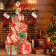 Stacked lighted Christmas gift box tower with 450 warm white lights, featuring vibrant bows for festive decor.