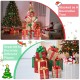Lighted Christmas gift box tower with 15 boxes in red and green, perfect for festive decoration indoors or outdoors.