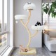 Tall beige cat tree with three cozy perches, dangling balls, and sturdy sisal scratching posts for playful lounging.