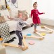 Kids balancing on a 12-piece wooden balance beam set with colorful stepping stones, promoting motor skills and.