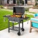 Outdoor BBQ charcoal grill with foldable side tables, wheels, and large cooking area for backyard gatherings.