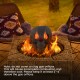 Realistic black skull fire pit decoration with flames escaping from eyes, perfect for Halloween ambiance and spooky.