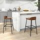 Industrial bar stools with low back and footrests, 29" height, perfect for kitchen islands or dining bars.
