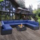 L-shaped 10 piece outdoor wicker conversation set with navy cushions, perfect for spacious patio gatherings.